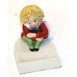 German figure of a seated Struwwelpeter by F R Greiner Rauenstein