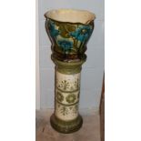 A Burmantofts jardiniere, 41cm by 33cm high, on an associated Leeds Art Pottery stand, 68cm high (