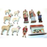 A miniature wooden Noah's ark with papered decoration and five carved animals, six sheep figures,