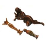 An Art Nouveau bronze figure of a reclining nude 15cm long, together with two figural desk seals (