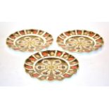 Three Royal Crown Derby Imari palette scallop edged plates, 22cm diameter . Minor surface wear,