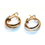 A pair of bi-colour hoop earrings, stamped '9KT', with post and clip fittings . Gross weight 9.14
