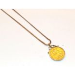 A sovereign dated 1889 loose mounted as a pendant on a 9 carat gold chain, chain length 61cm .