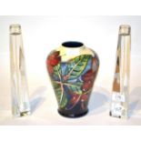 A Moorcroft vase, 21.5cm high; and a pair of Jasper Conran Waterford crystal candlesticks, 27.5cm
