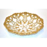 A 19th century Meissen relief moulded part gilt embellished dish, 23cm diameter . Wear to gilding