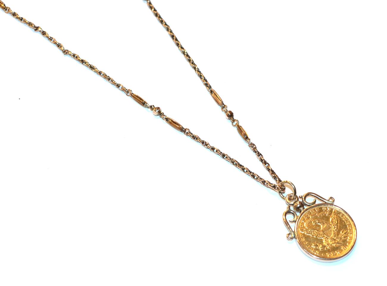 A USA ten dollar coin, dated 1893 mounted as a pendant, on a fancy link chain, stamped '9C' .