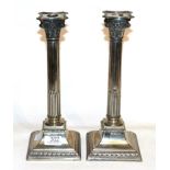 A pair of silver plated Corinthian column candlesticks with sconces, stamped WMFN, 31cm high