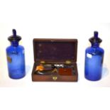 A pair of blue glass apothecary jars and a cased meerschaum pipe (3)