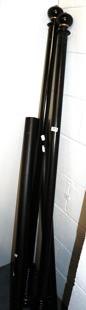 Pair of ebonised curtain poles and two others, largest 188cm long