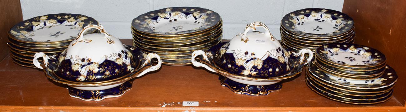 A Victorian cobalt blue and gilt highlighted part dinner service, including two tureens and