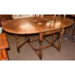 A Titchmarsh & Goodwin style oak drop-leaf dining table fitted with two drawers, 187cm (open) by