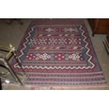An Afshar flatweave rug, the polychrome field of bands of geometric devices enclosed by stylised