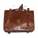 Brown crocodile briefcase, with modern lined and named lining, leather straps with buckles,