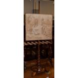 A Victorian rosewood pole screen with boldly turned upright and needlework panel, 133cm high