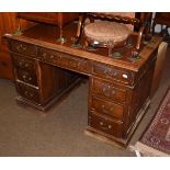 A late 19th century oak twin pedestal desk, red leather inset, arrangement of nine drawers, plinth