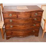 A George III serpentine fronted mahogany four-height chest of drawers, 110cm by 59cm by 96cm high