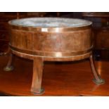 A late 18th/early 19th century copper-bound planter/cellarette, of oval coopered form, four