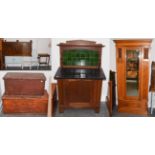 A group of furniture comprising two stained pine blanket chests; an Edwardian oak slate-topped