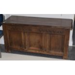 A late 17th century joined oak chest, the hinged lid above a guilloche carved frieze with initials
