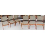 A set of six 1970's teak framed dining chairs