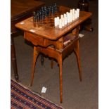 A 19th century oak games table with an inlaid top, on square tapered legs, 60cm by 39cm by 72cm high