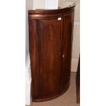 A George III inlaid mahogany bow-fronted hanging corner cupboard, 68cm by 110cm high