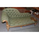 A 19th century gilt-framed chaise longue, upholstered in green buttoned fabric (distressed), 198cm