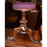 A 19th century mahogany adjustable piano stool with simulated rosewood grain and upholstered seat,