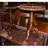 An Acorn Industries inlaid stained mahogany tripod table with scalloped top and carved acorn