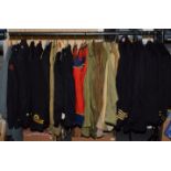 Assorted military garments including jackets, mess jackets, khaki shirts etc (one rail)