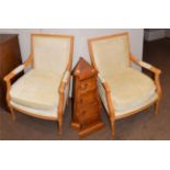 A pair of modern beech-framed armchairs in the French taste