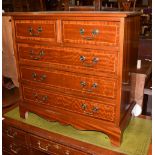 A Georgian style mahogany and crossbanded chest of drawers, two short over three long drawers,