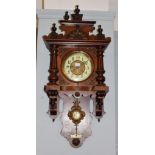 A late 19th/early 20th century mahogany veneered wall clock, 39cm by 83cm high