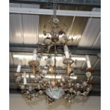 A gilt-metal and glass eight-light chandelier, 90cm drop (approx) by 75cm wide (approx)