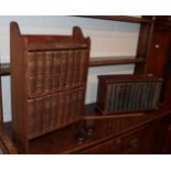 Two oak table-top bookcases, housing a set of novels by Dickens and another set by H.G.Wells