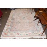 A Chinese carved carpet, the blush ivory field with floral decoration, 280cm by 186cm