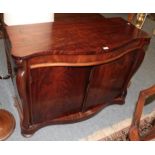 A mahogany serpentine topped chiffonier, 117cm by 52cm by 84cm