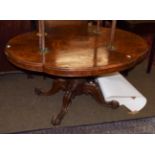 A Victorian walnut quarter veneer loo table of quatre form shape, tilt top, gardrooned column and