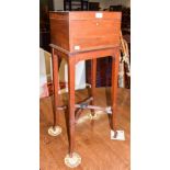 A 19th century mahogany vanity case on stand, the cover opening to reveal a mirrored fitted