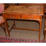 An Edwardian mahogany writing desk, brown leather inset, two drawers, square tapered legs, 91cm by