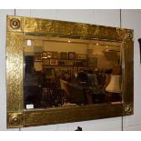 A Scottish Arts & Crafts brass framed mirror, 87cm by 62cm