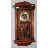 An Art Deco wall clock, the dial with Arabic numerous and silvered chapter ring, above a glazed