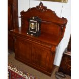 A Victorian mahogany chiffonier, raised gallery back with carved foliate scroll pediment and