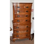 A reproduction mahogany tallboy fitted with two short over six long drawers and a dressing slide,
