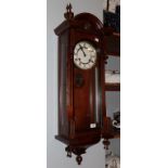 A walnut Vienna style striking wall clock