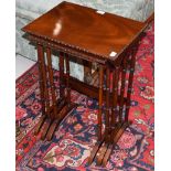 A set of three 20th century mahogany nesting tables, largest 47cm by 34cm by 68cm high