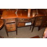 A George III bowfront sideboard the central drawer flanked by two further drawers above cellarette