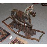 A 19th century painted push along horse together with associated mahogany rocker, 123cm long