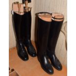 A pair of new John Lobb long black leather hunting boots with trees (size 5.5), and a pair of