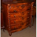 A Victorian mahogany bow-fronted four-height chest of drawers, with boldly turned uprights, 114cm by